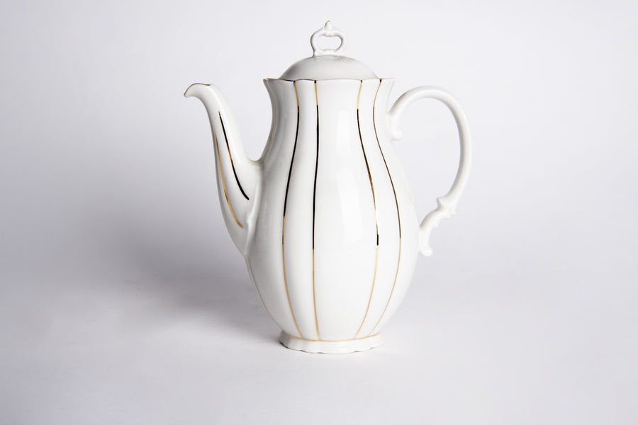 White teapot with gold details