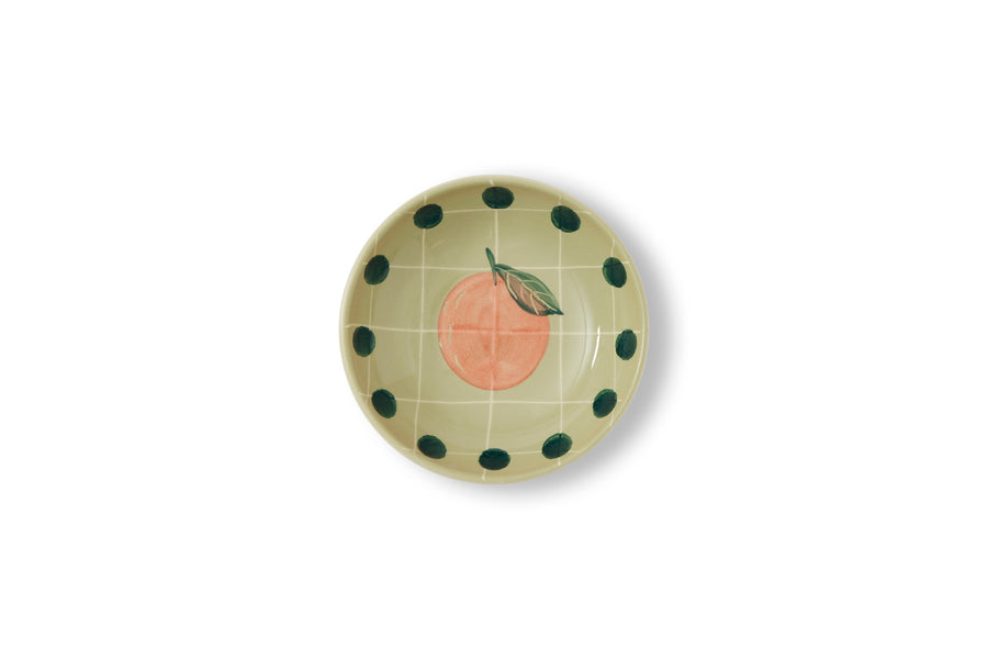 Green cup with polka dot border